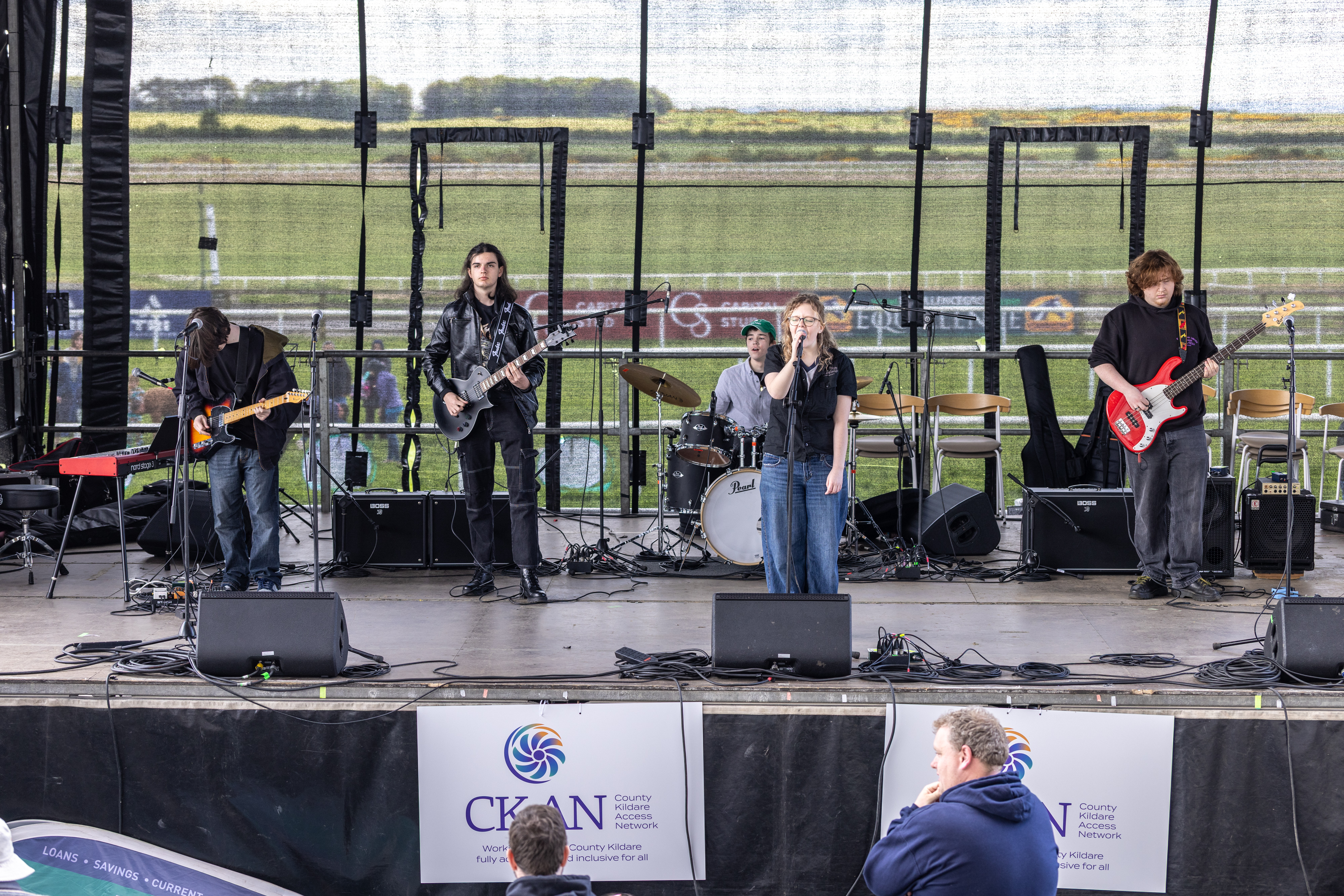 A band on stage preforming. 